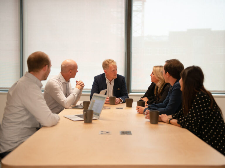 David Dand, Coreus Founder & Director, at a team meeting