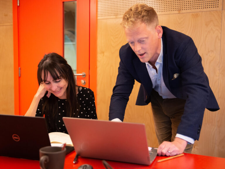 David Dand Coreus Founder & Director working with colleague